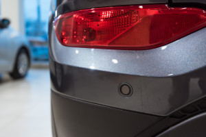 Closeup photograph of parking sensors on a modern car