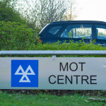 MOT test centre sign and car